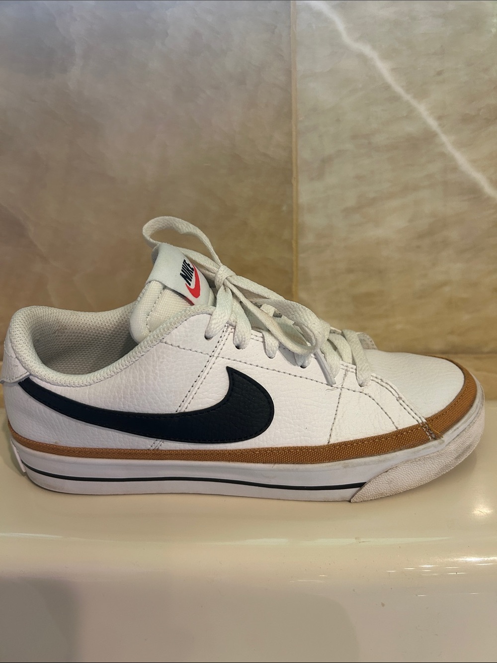 Nike Womens White Sneakers with Black Swoosh and Brown Trim